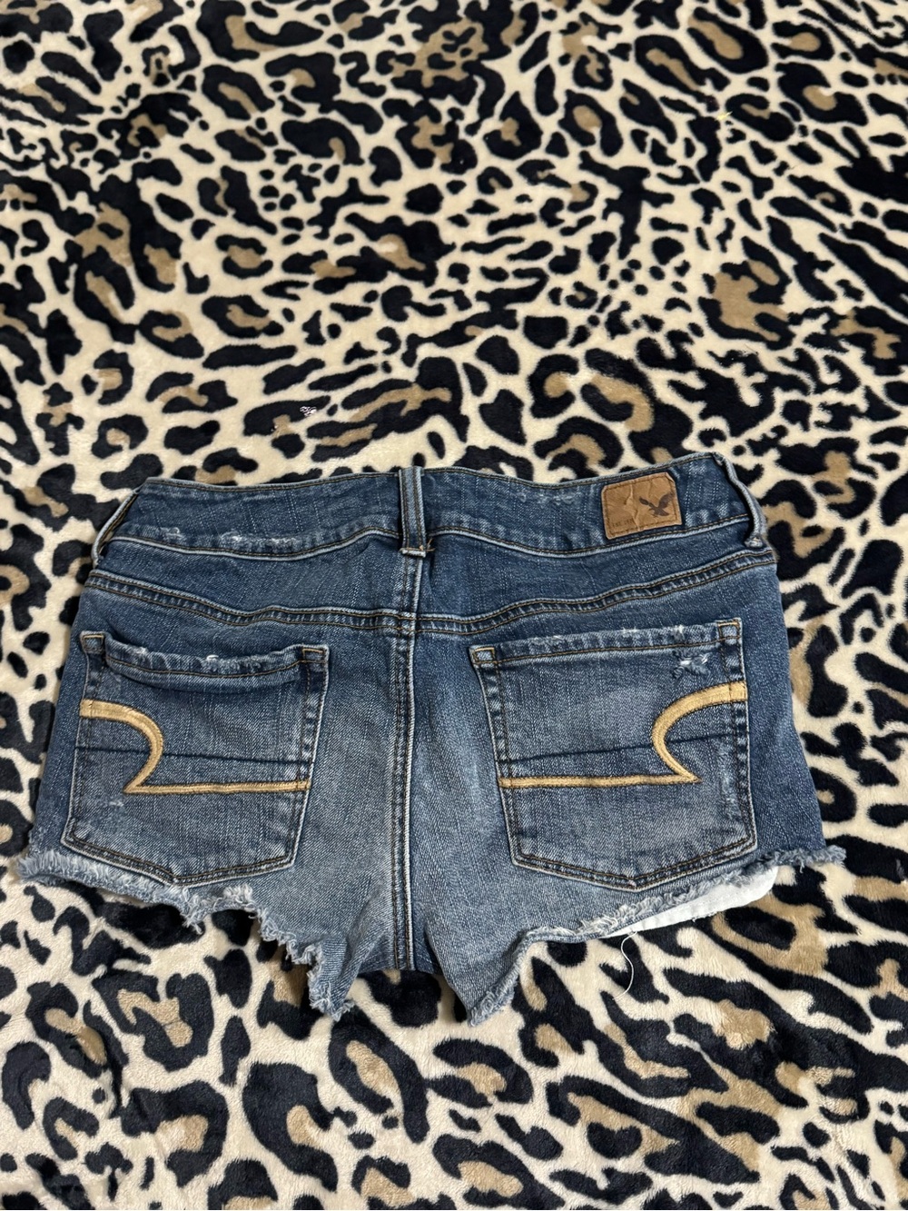 American Eagle Outfitters Blue Denim Cutoff Shorts with Gold Stitching